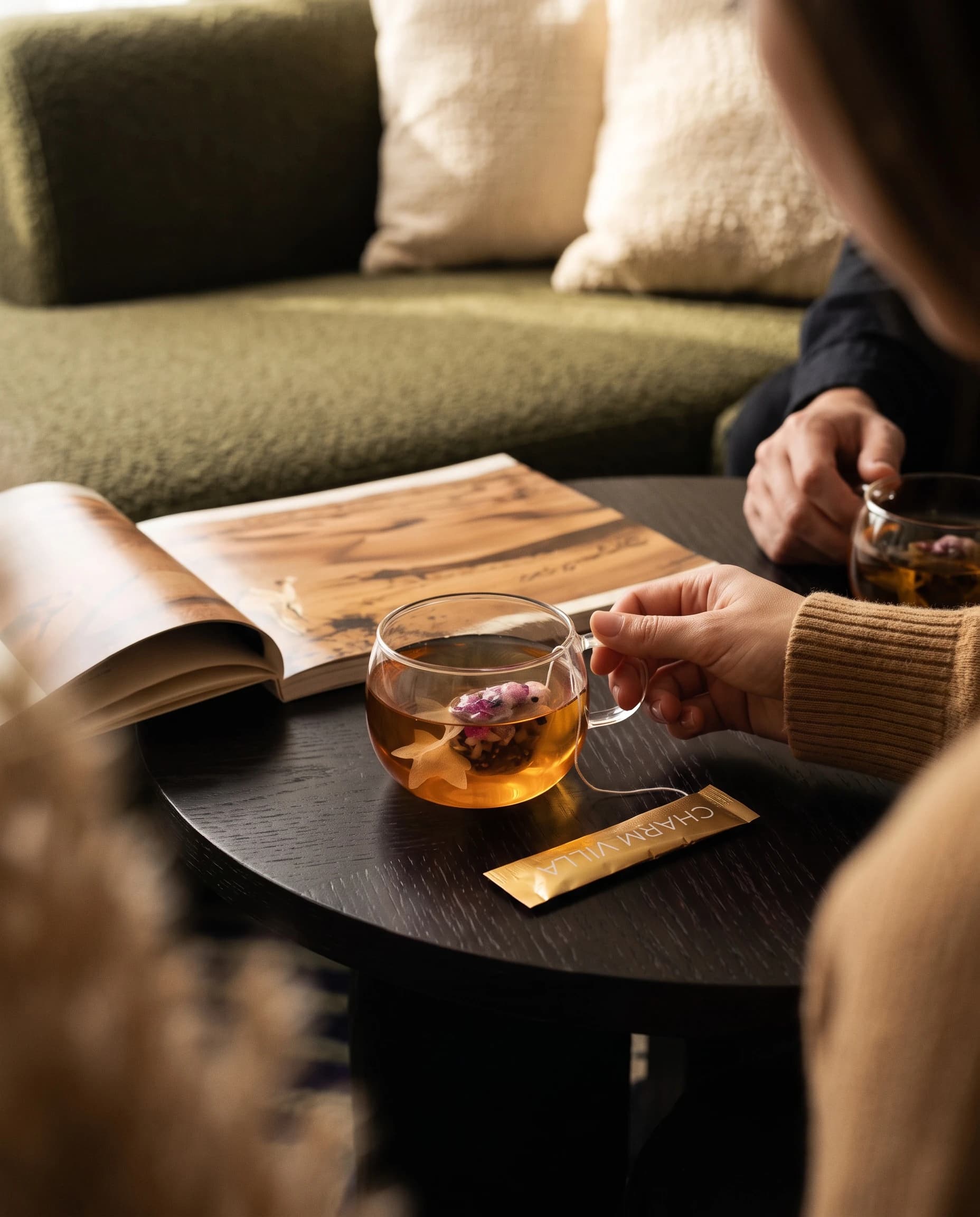 Two people sharing goldfish tea